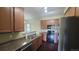 The lovely eat-in kitchen features plentiful cabinet space, modern appliances, and dark wood floors at 1653 Valley Oak Ct, Castle Rock, CO 80104