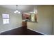 This open eat-in kitchen features modern appliances, lots of cabinet space and dark wood floors at 1653 Valley Oak Ct, Castle Rock, CO 80104