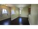 An open floor plan leads from the dining room to the living room with dark wood floors at 1653 Valley Oak Ct, Castle Rock, CO 80104