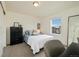 Bright bedroom featuring a large window and neutral walls, creating a relaxing atmosphere at 16341 Clayton St, Thornton, CO 80602