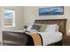 Spacious main bedroom featuring a comfortable bed, a stylish window, and lots of natural light at 16341 Clayton St, Thornton, CO 80602