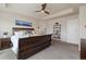 Spacious main bedroom featuring tray ceilings, a ceiling fan, and lots of natural light at 16341 Clayton St, Thornton, CO 80602