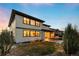 Spacious backyard featuring a covered patio, ample seating, and lush lawn at 16370 Graham Peak Way, Broomfield, CO 80023