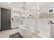 This bathroom features a soaking tub, tiled shower, modern fixtures, and ample vanity storage at 16370 Graham Peak Way, Broomfield, CO 80023