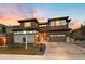 Beautiful home for sale boasting modern architecture and manicured landscaping at sunset at 16370 Graham Peak Way, Broomfield, CO 80023