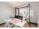 Home office boasts hardwood floors, multiple monitors, modern decor, and a large window at 16370 Graham Peak Way, Broomfield, CO 80023