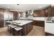 Spacious kitchen featuring a large island with seating and stainless steel appliances at 16370 Graham Peak Way, Broomfield, CO 80023