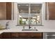 Modern kitchen sink with stainless steel sink and faucet, with a view of the outside at 16370 Graham Peak Way, Broomfield, CO 80023