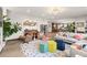 Bright and airy living room with stylish furnishings and decor, blending comfort and elegance at 16370 Graham Peak Way, Broomfield, CO 80023