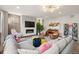 Relaxing living room area featuring a fireplace, comfortable seating, and modern decor at 16370 Graham Peak Way, Broomfield, CO 80023