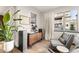Comfortable sitting area with stylish furniture and an exterior view at 16370 Graham Peak Way, Broomfield, CO 80023