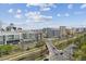 An aerial view showcasing the city skyline and vibrant surroundings, offering a sense of urban living at 1301 Speer Blvd # 1108, Denver, CO 80204