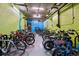 Common room for bicycle storage with plenty of bikes parked on the floor and walls at 1301 Speer Blvd # 1108, Denver, CO 80204