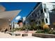 The building's unique architecture is complemented by landscaping and pedestrian areas at 1301 Speer Blvd # 1108, Denver, CO 80204