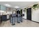 Modern kitchen with stainless steel appliances, breakfast bar, contemporary cabinets, and natural light in an urban setting at 1301 Speer Blvd # 1108, Denver, CO 80204