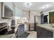 Sleek kitchen boasting stainless steel appliances, stylish cabinetry, and a subway tile backsplash for modern appeal at 1301 Speer Blvd # 1108, Denver, CO 80204