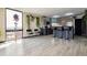Bright, modern kitchen featuring stainless steel appliances, stone counter tops, and breakfast bar in sunlit room with city views at 1301 Speer Blvd # 1108, Denver, CO 80204