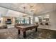A community area with bar stools, a pool table, and a fireplace at 1301 Speer Blvd # 1108, Denver, CO 80204
