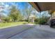 This backyard showcases a large grassy lawn with an outdoor table and a storage shed at 6018 Owens St, Arvada, CO 80004