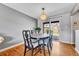 Dining room showcasing hardwood floors and a sliding glass door to backyard at 6018 Owens St, Arvada, CO 80004