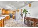 Well-lit kitchen featuring oak cabinets, stainless steel appliances, and tile floors at 6018 Owens St, Arvada, CO 80004