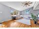 Spacious living room featuring a plush sectional sofa, hardwood floors, and ample natural light at 6018 Owens St, Arvada, CO 80004