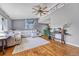 Open living area with hardwood flooring, comfortable seating, and lots of natural light at 6018 Owens St, Arvada, CO 80004