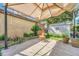 The patio offers a cozy spot under a gazebo, beside planter boxes, for outdoor relaxation at 6018 Owens St, Arvada, CO 80004