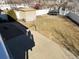 Backyard featuring a shed, play structure, trampoline, and concrete patio perfect for outdoor activities at 21561 E 48Th Pl, Denver, CO 80249