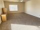 Bedroom featuring a window and neutral carpet at 21561 E 48Th Pl, Denver, CO 80249