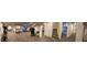 Panoramic view of the basement gym featuring durable carpet, workout equipment, and staircase in the background at 21561 E 48Th Pl, Denver, CO 80249