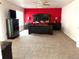 Bedroom with red accent wall, black furniture and modern decor at 21561 E 48Th Pl, Denver, CO 80249