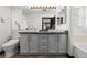 Modern bathroom with double vanity and updated fixtures at 20602 E Jefferson Ave, Aurora, CO 80013