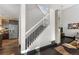 Elegant staircase with white railings leading to the upper level at 20602 E Jefferson Ave, Aurora, CO 80013