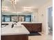 Primary bathroom with dual sinks, elegant lighting, and a large mirror reflecting the luxurious design at 11013 Valleybrook Cir, Highlands Ranch, CO 80130
