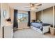 Bright bedroom with a large window, a comfortable bed, and stylish curtains for a cozy retreat at 11013 Valleybrook Cir, Highlands Ranch, CO 80130