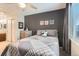 Inviting bedroom features neutral colors, a ceiling fan, and a window offering a peaceful view at 11013 Valleybrook Cir, Highlands Ranch, CO 80130
