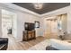 Well-lit living room featuring hardwood floors, gray walls, and an open floor plan into the other rooms at 11013 Valleybrook Cir, Highlands Ranch, CO 80130