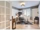 Bright home office with French doors, designer touches, and a large window with modern blinds at 11013 Valleybrook Cir, Highlands Ranch, CO 80130