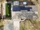 Aerial view of house with solar panels, hot tub, and artificial turf backyard at 7746 S Gray St, Littleton, CO 80128