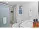 Clean bathroom features a shower/tub combo, toilet and modern vanity at 7746 S Gray St, Littleton, CO 80128