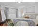 Spacious bedroom with a comfortable bed and ample natural light at 7746 S Gray St, Littleton, CO 80128