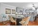 Kitchen dining area with table for six and hardwood floors at 7746 S Gray St, Littleton, CO 80128