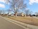 Landscaped lot with a spacious ranch home and large tree at 7746 S Gray St, Littleton, CO 80128