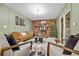 Cozy Gathering room with brick fireplace and sliding glass doors at 7746 S Gray St, Littleton, CO 80128