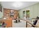 Cozy living room with fireplace and sliding glass doors leading to a patio at 7746 S Gray St, Littleton, CO 80128