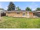 Expansive backyard with a spacious deck and built-in seating, perfect for outdoor living at 4629 Estes St, Wheat Ridge, CO 80033