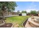 A well-manicured lawn, wood fence and a spacious deck offer private outdoor enjoyment at 4629 Estes St, Wheat Ridge, CO 80033
