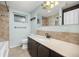 A bathroom with a light blue wall and a long vanity at 4629 Estes St, Wheat Ridge, CO 80033