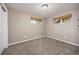 Carpeted bedroom with neutral walls and woven blinds at 4629 Estes St, Wheat Ridge, CO 80033